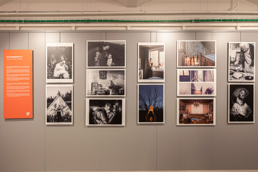 a wall showcasing photoworks during the Mythography V exhibition